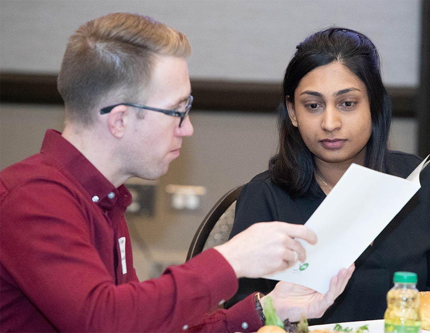 Conference attendees interacting