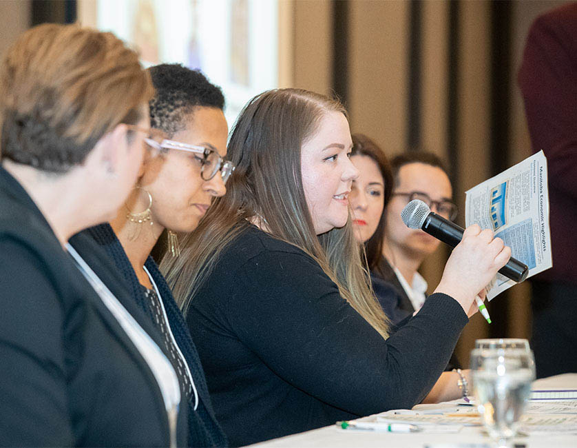 Panel interacting with Conference Participants